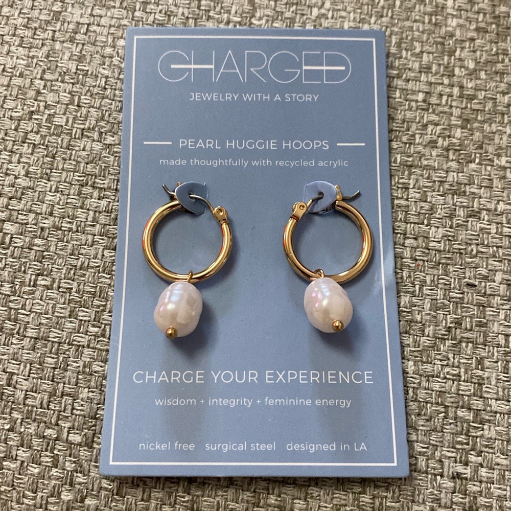 Charged pearl huggie hoops. Brand new